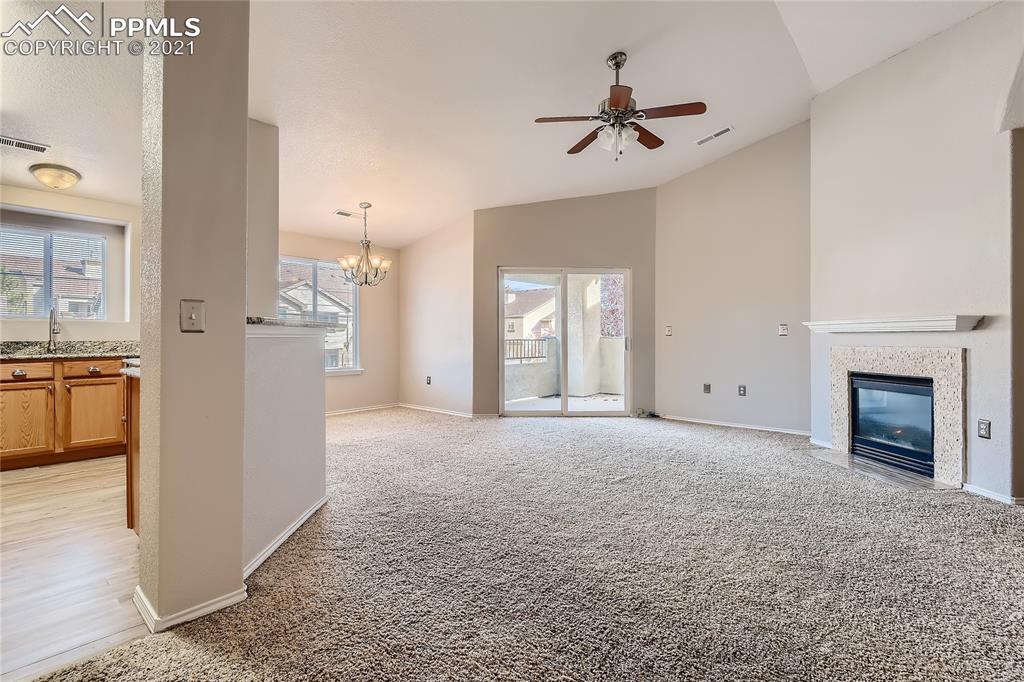 3780 Riviera Grove, Unit 204 Colorado Springs, CO 80922 - Photo 8 of 33 a view of a livingroom with a fireplace and window