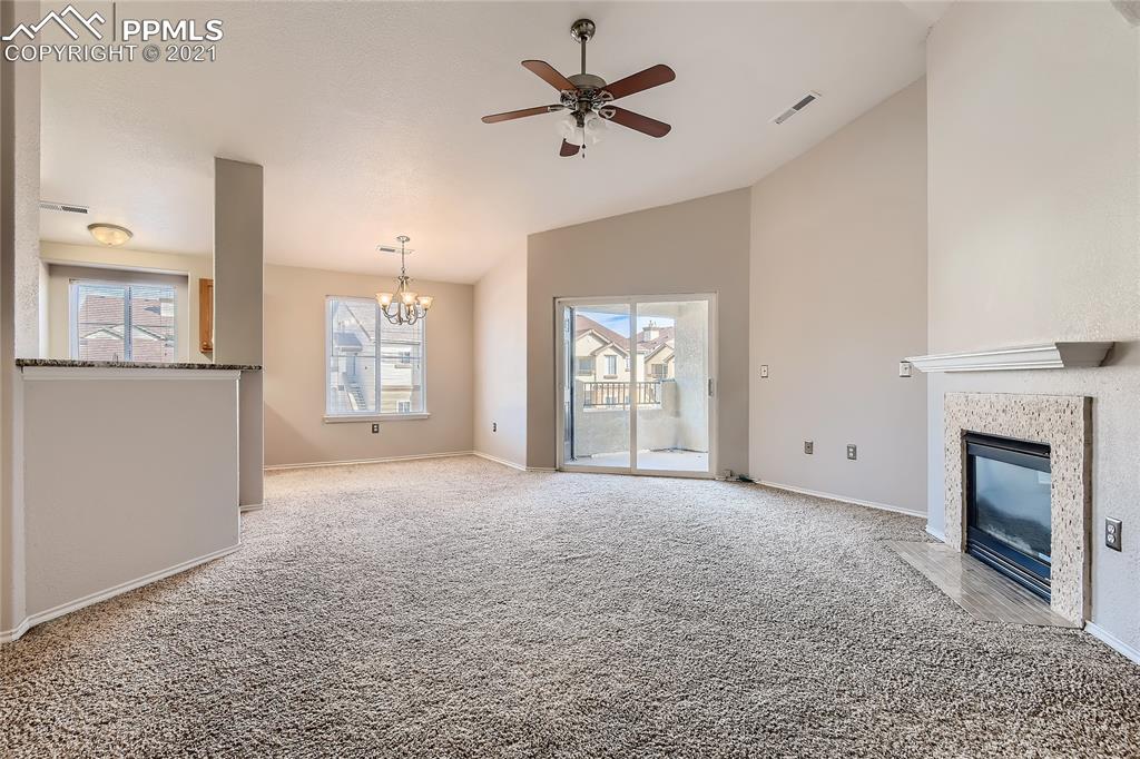 3780 Riviera Grove, Unit 204 Colorado Springs, CO 80922 - Photo 9 of 33 a view of a livingroom with a fireplace and window