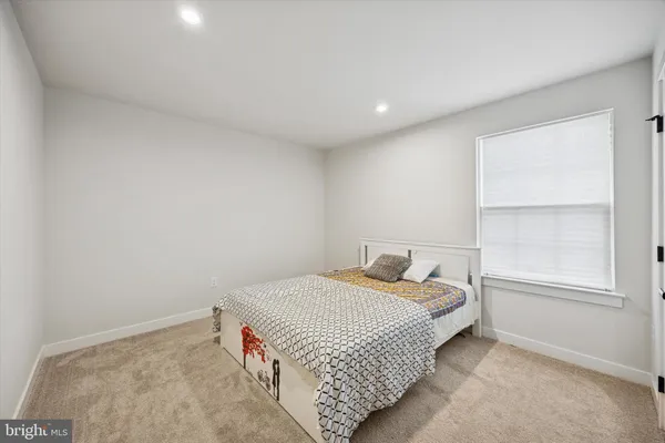 a room with a bed and a window