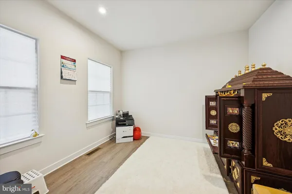 a bedroom with a bed and a tv