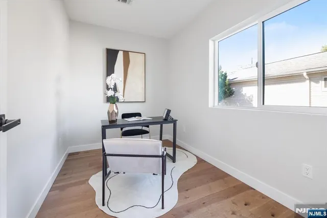a bed room with a bed and a window