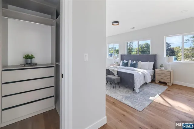 a spacious bathroom with a bathtub and shower