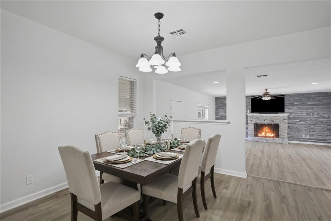 1601 Owens Avenue Three Rivers, TX 78071 - Photo 15 of 34 a view of a dining room with furniture and wooden floor