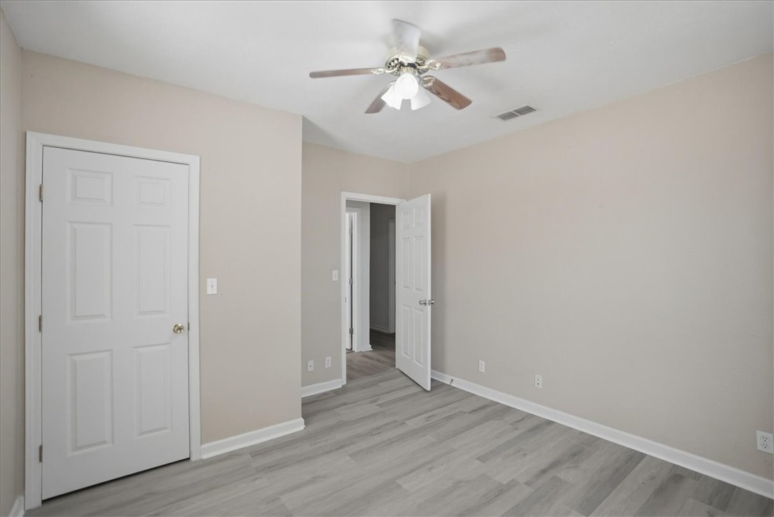 1601 Owens Avenue Three Rivers, TX 78071 - Photo 22 of 34 a view of an empty room with wooden floor