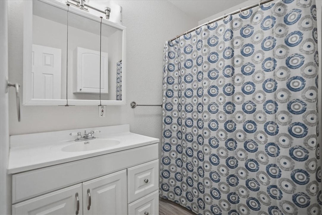 1601 Owens Avenue Three Rivers, TX 78071 - Photo 25 of 34 a bathroom with a sink and a mirror