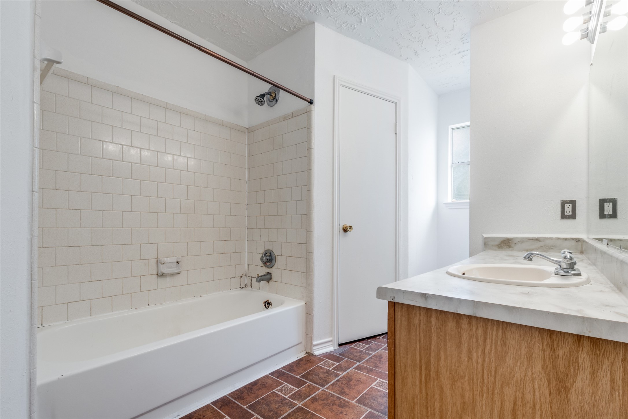 2014 Powder Mist Lane Katy, TX 77449 - Photo 6 of 12 Primary bathroom has a shower/tub combo and a linen closet.