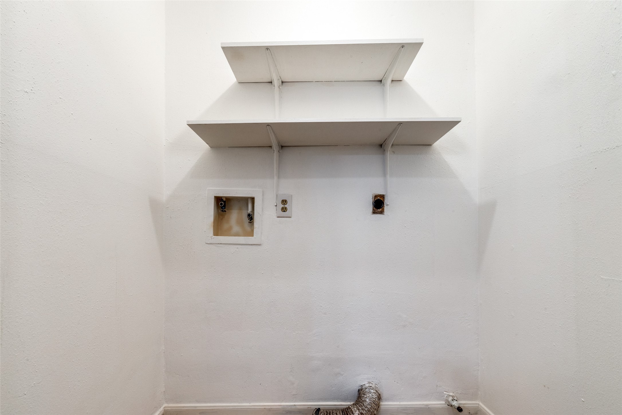 2014 Powder Mist Lane Katy, TX 77449 - Photo 10 of 12 The laundry room is in the hallway near the primary bedroom.