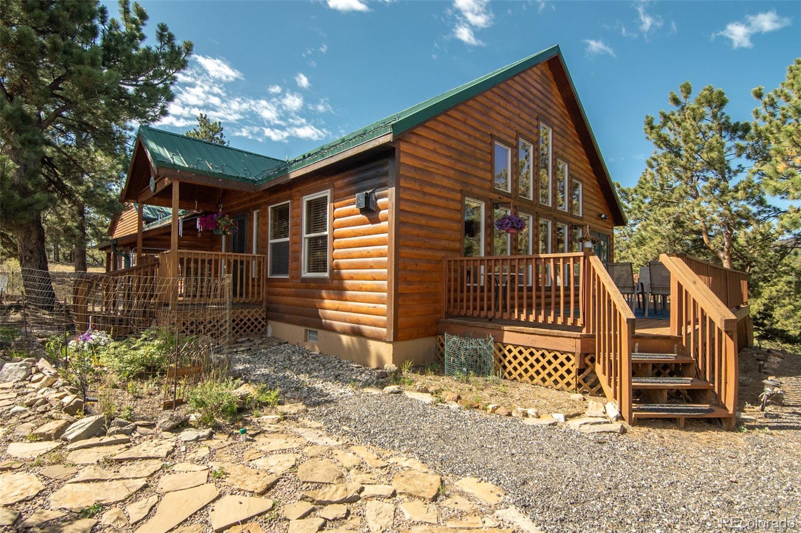 3296 Singletree Road Hartsel, CO 80449 - Photo 1 of 50 a front view of a house