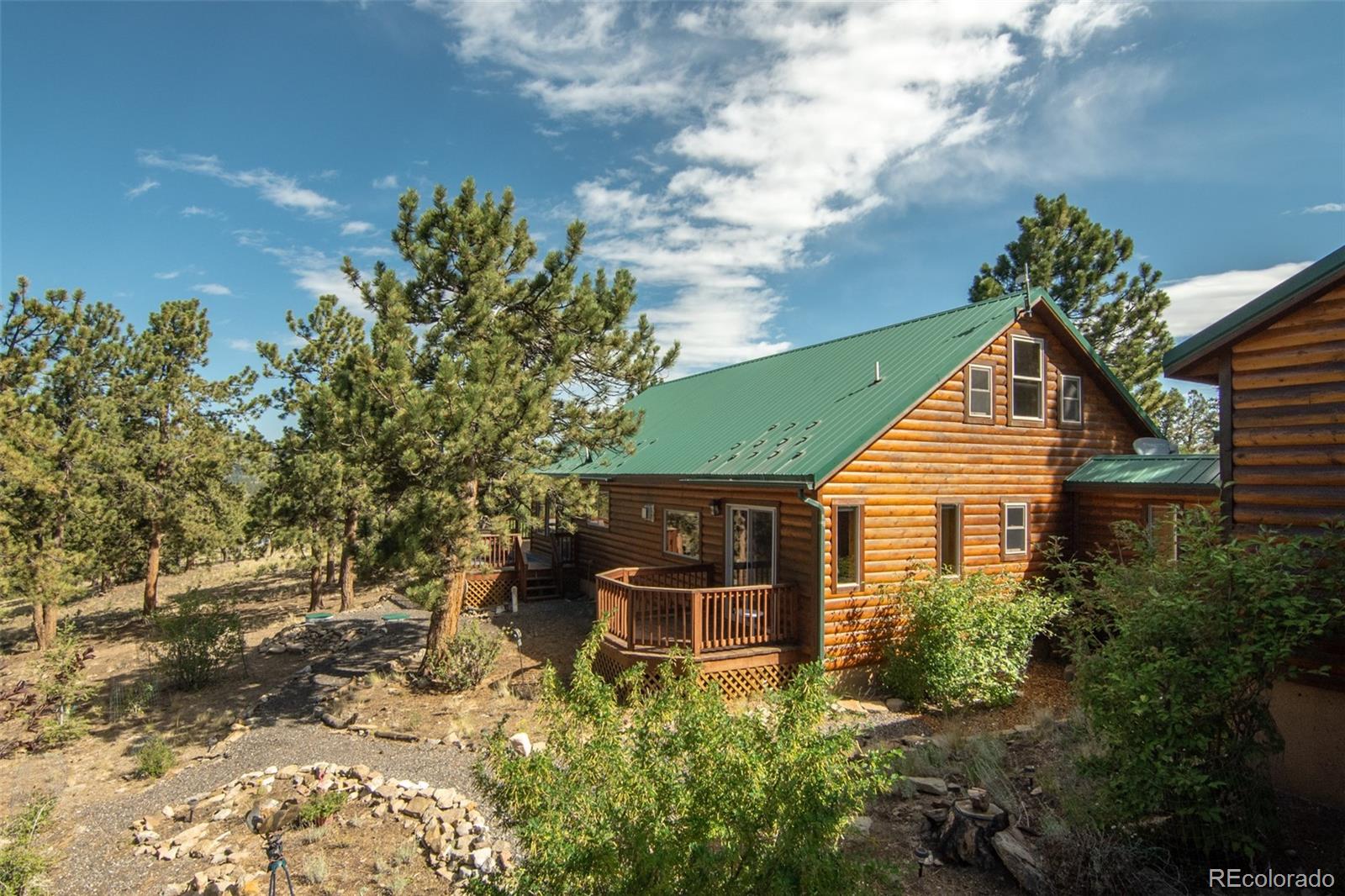 3296 Singletree Road Hartsel, CO 80449 - Photo 14 of 50 a backyard of a house with table and chairs