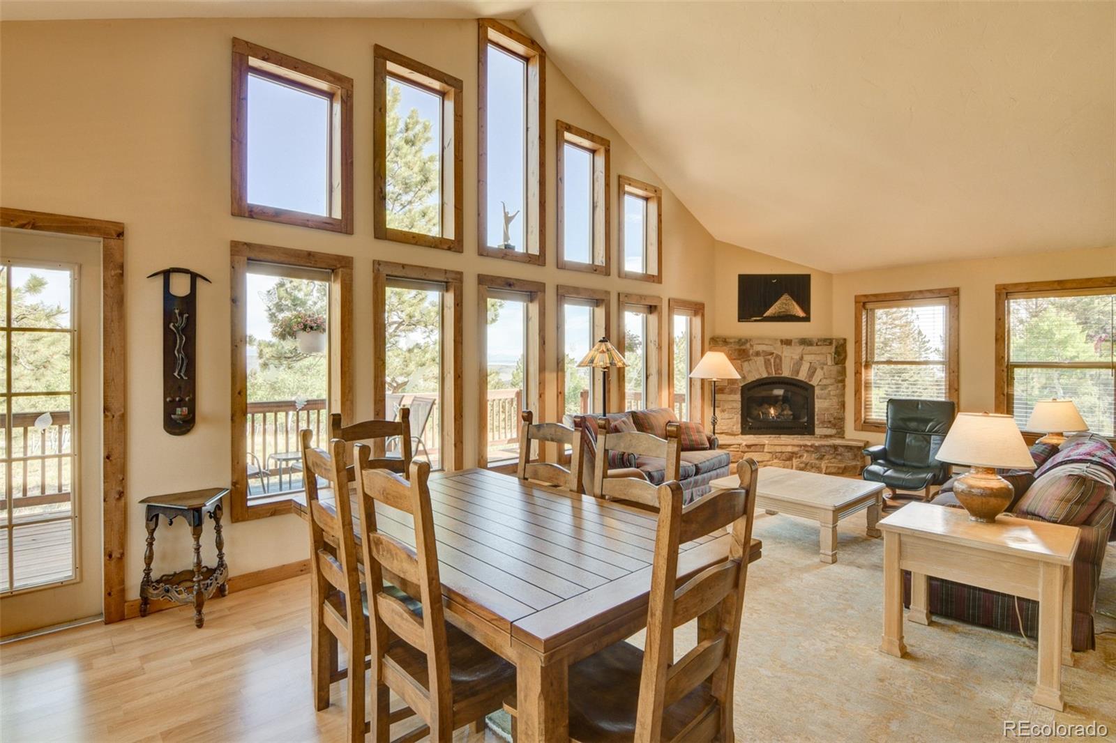 3296 Singletree Road Hartsel, CO 80449 - Photo 17 of 50 a living room with fireplace furniture and a large window