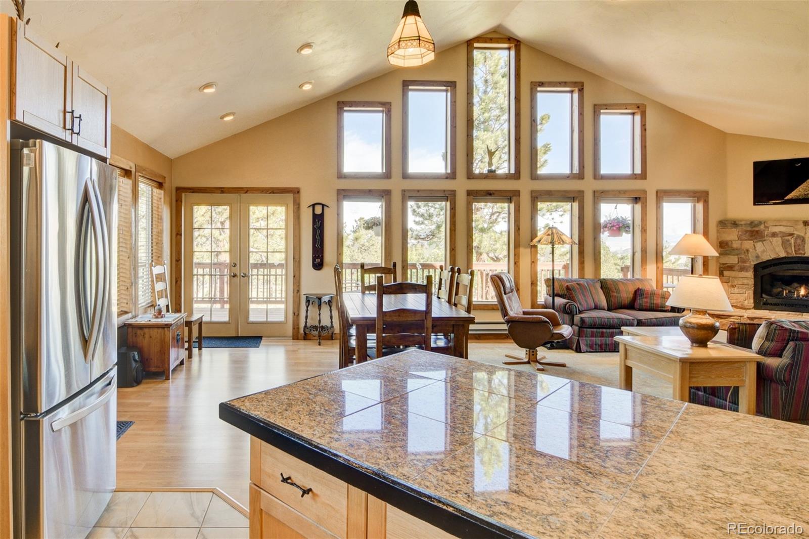 3296 Singletree Road Hartsel, CO 80449 - Photo 19 of 50 a living room with fireplace furniture and a large window