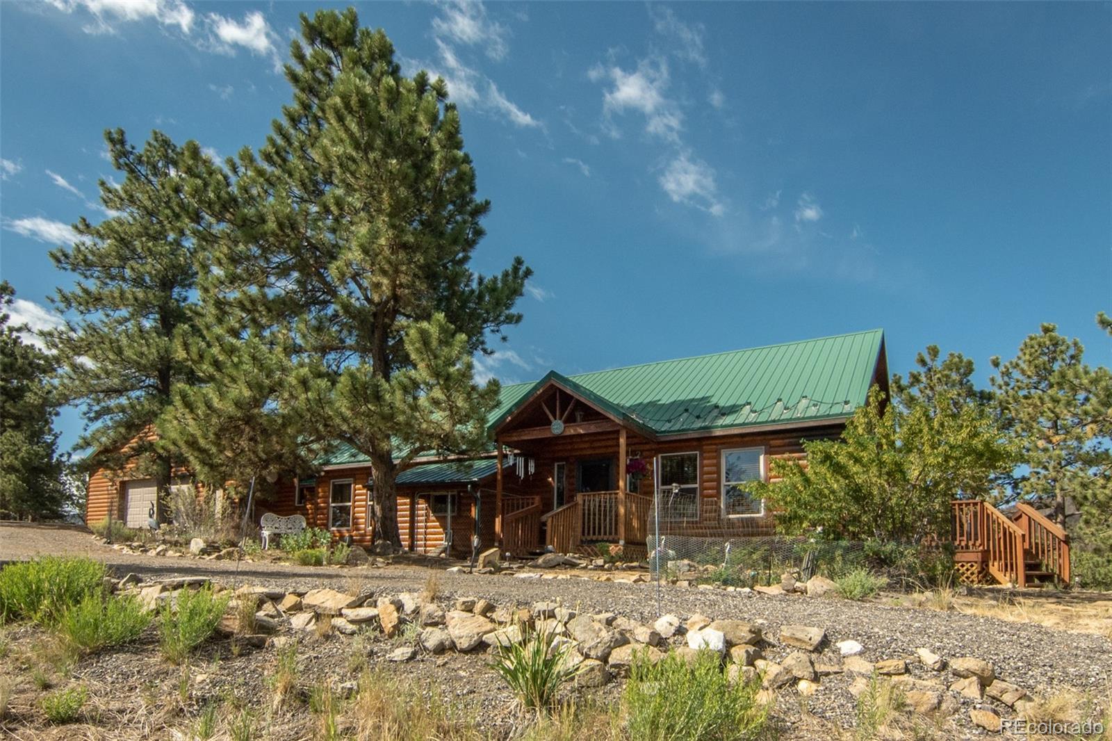 3296 Singletree Road Hartsel, CO 80449 - Photo 2 of 50 a front view of a house with a yard
