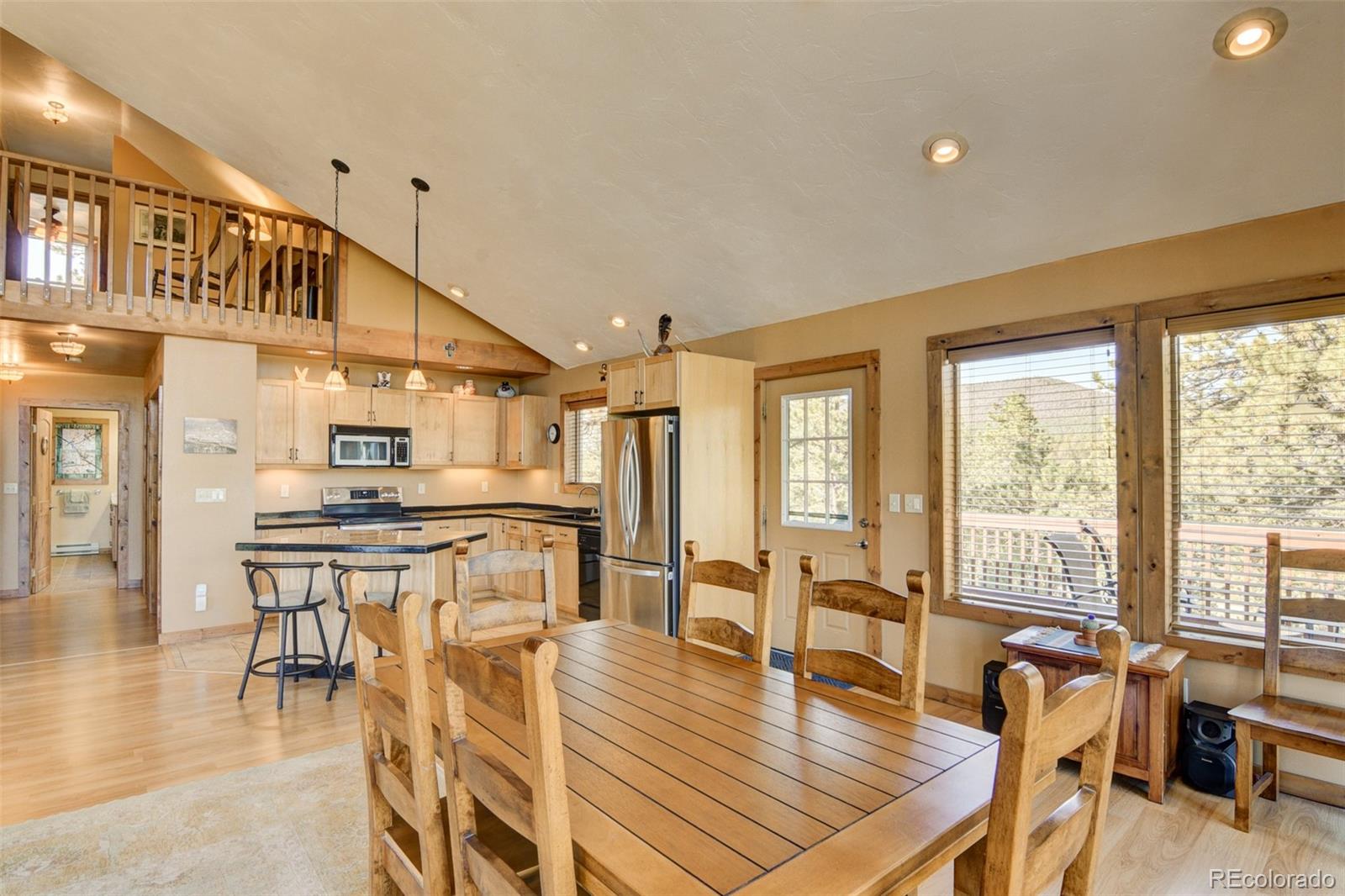 3296 Singletree Road Hartsel, CO 80449 - Photo 22 of 50 a living room with furniture a wooden floor and next to a window
