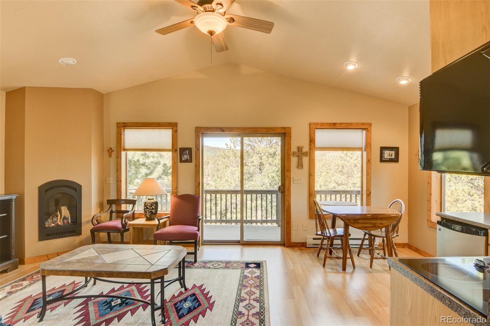 3296 Singletree Road Hartsel, CO 80449 - Photo 41 of 50 a living room with furniture and a large window