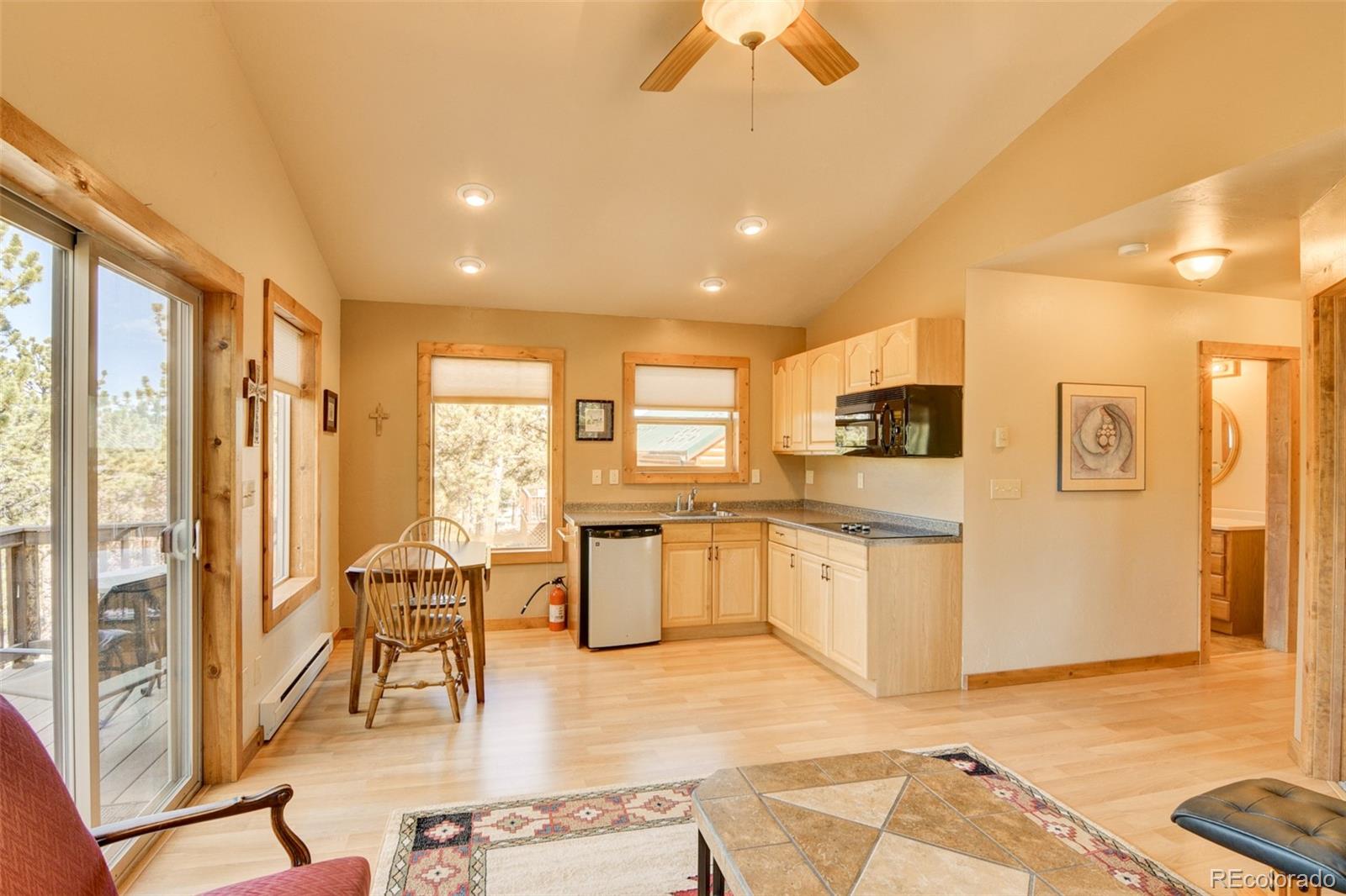 3296 Singletree Road Hartsel, CO 80449 - Photo 44 of 50 a living room with stainless steel appliances granite countertop furniture and a kitchen view