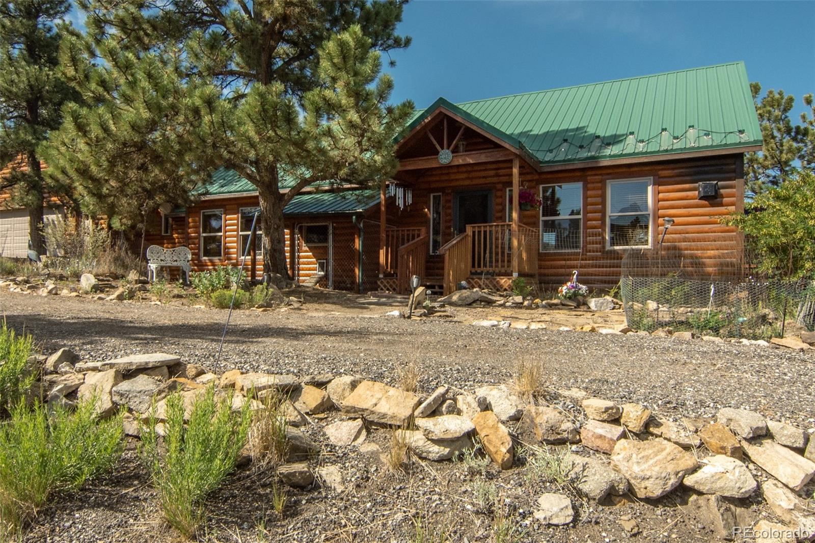 3296 Singletree Road Hartsel, CO 80449 - Photo 49 of 50 a front view of a house with a yard