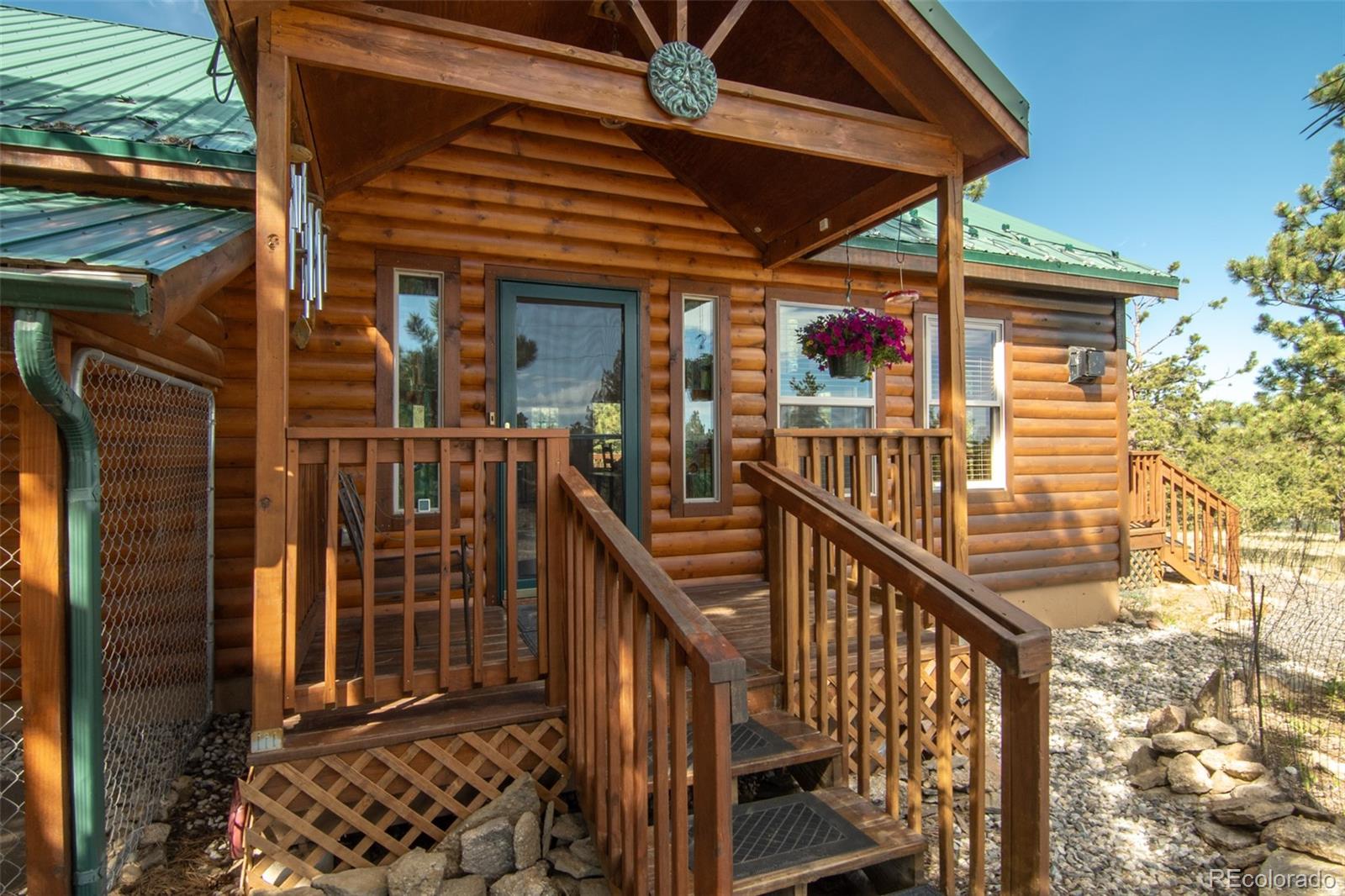 3296 Singletree Road Hartsel, CO 80449 - Photo 7 of 50 a view of balcony with wooden floor and outdoor seating