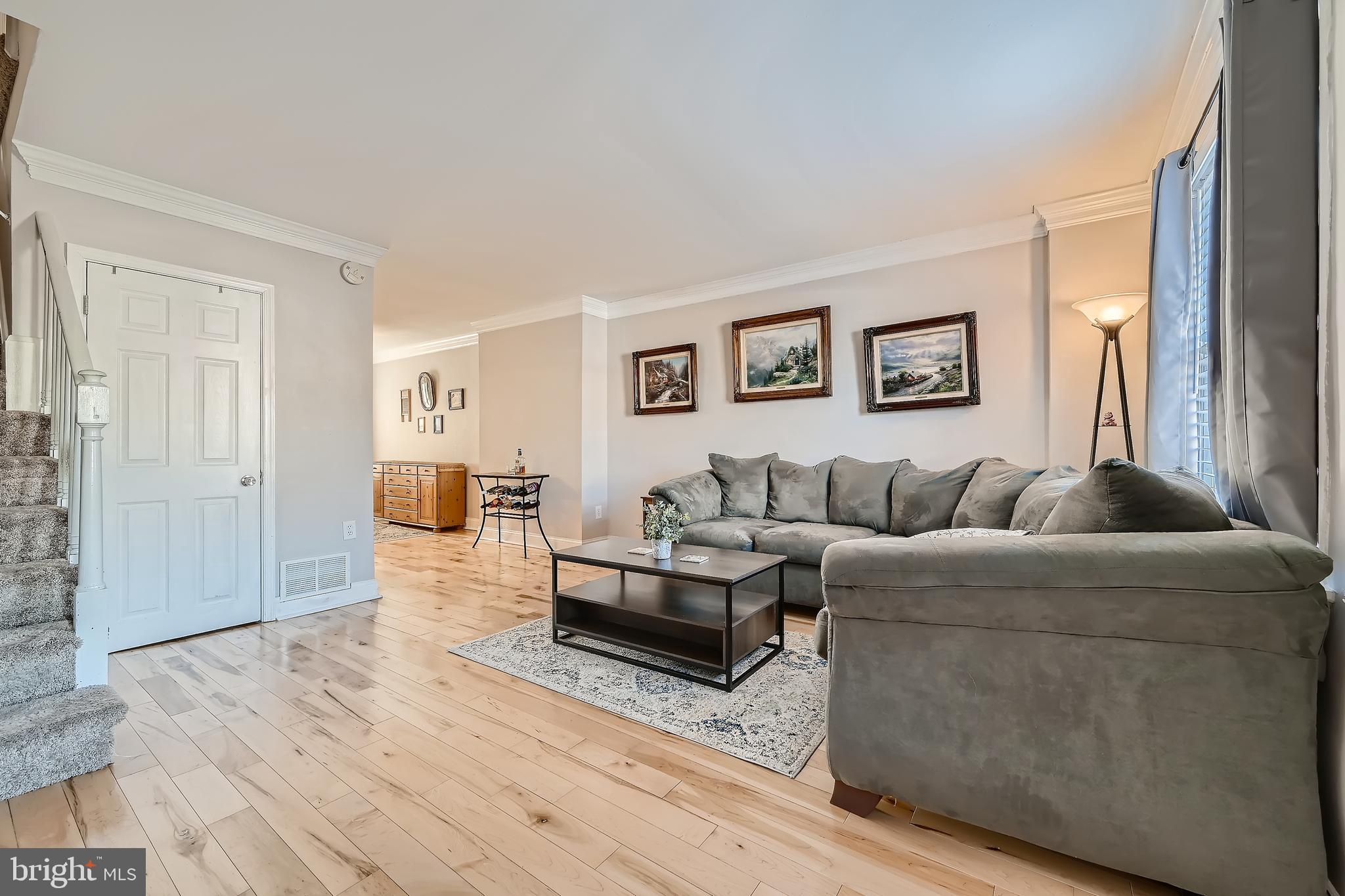 232 Riverthorn Road Baltimore, MD 21220 - Photo 8 of 28 Spacious Living room w/ Crown Molding