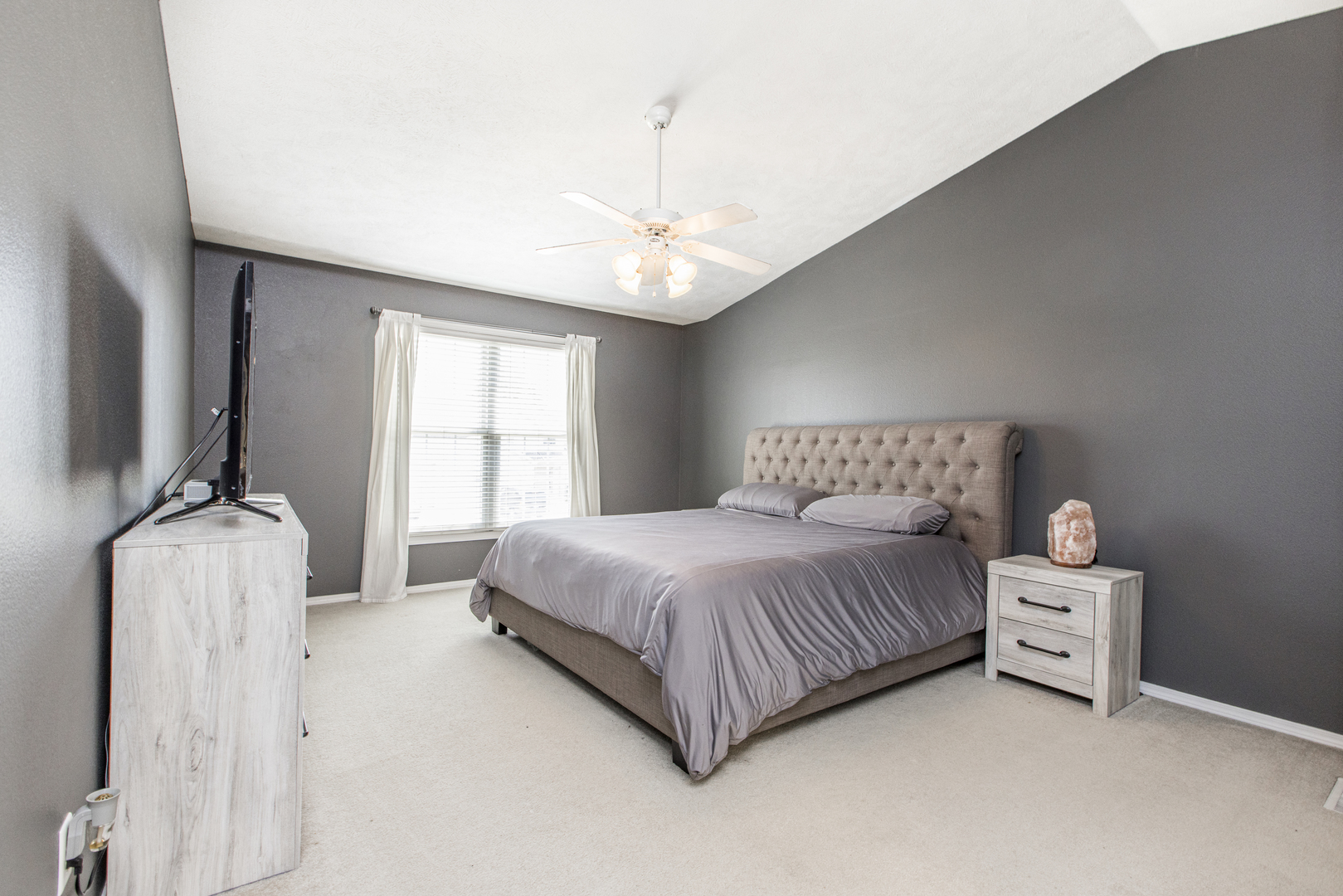 3230 Turquois Way Normal, IL 61761 - Photo 11 of 28 a spacious bedroom with a bed and a flat tv screen on dresser