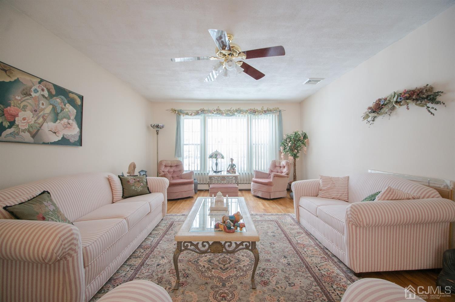 9 Library Place Edison, NJ 08820 - Photo 12 of 44 a living room with furniture and a large window