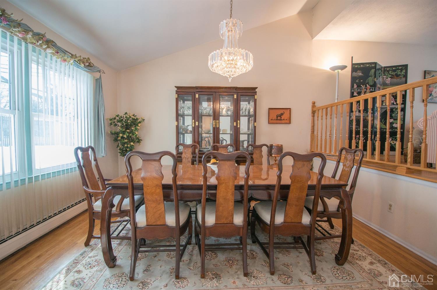 9 Library Place Edison, NJ 08820 - Photo 15 of 44 a view of a dining room with furniture window and wooden floor
