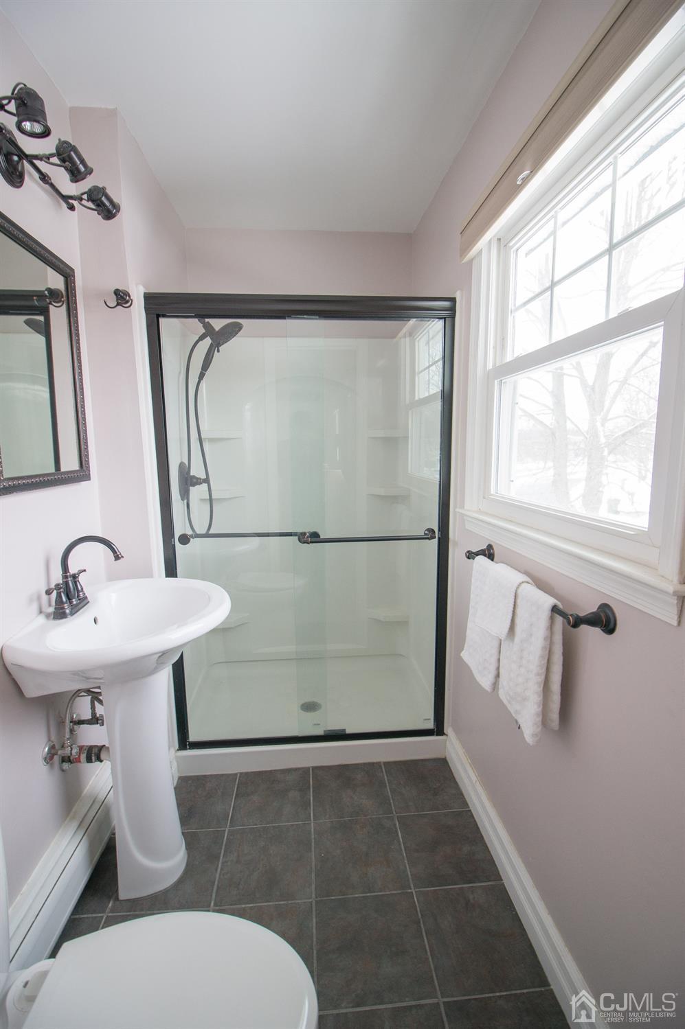 9 Library Place Edison, NJ 08820 - Photo 38 of 44 a bathroom with a sink toilet and shower