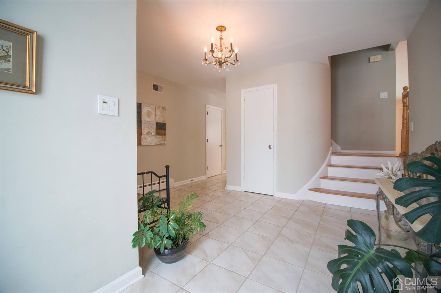 9 Library Place Edison, NJ 08820 - Photo 5 of 44 a view of a hallway with a potted plant