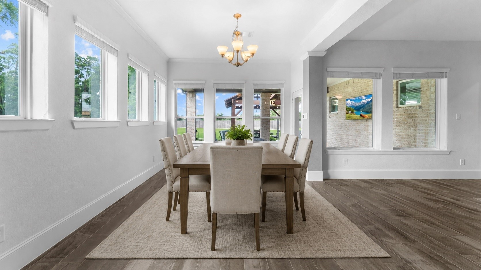 32001 Birch Briar Court Spring, TX 77386 - Photo 13 of 48 Elegant formal dining room with expansive windows, designer lighting, and plenty of space for family dinners and holiday gatherings. Virtually staged