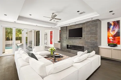 a living room with furniture and a large window