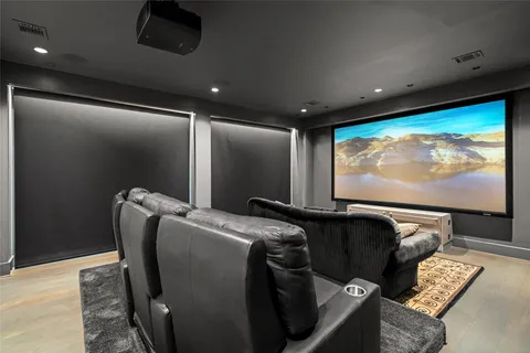 a spacious bedroom with a bed and a flat screen tv