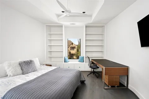 a view of a workspace with furniture and a flat screen tv