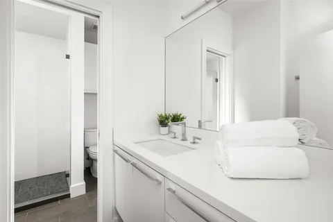 a room with a large window and furniture