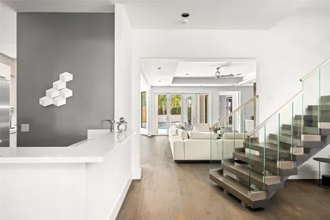 a view of kitchen with stainless steel appliances cabinets