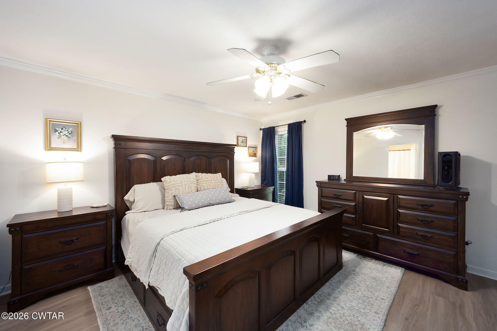 80 Rooker Drive Jackson, TN 38305 - Photo 5 of 30 a bedroom with a bed and a dresser