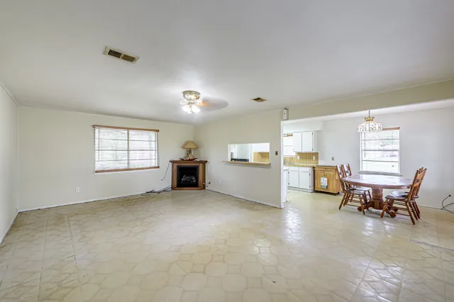 a kitchen with a stove a sink and a refrigerator