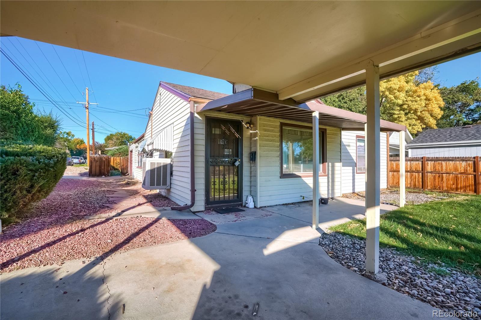 4685 Pierce Street Wheat Ridge, CO 80033 - Photo 8 of 26 a view of a house with backyard porch and sitting area