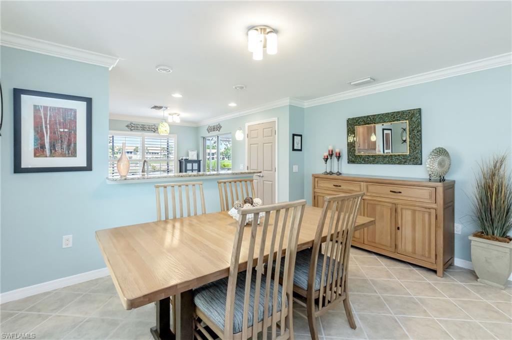 5801 Declaration Court Ave Maria, FL 34142 - Photo 11 of 38 a dining room with furniture and window