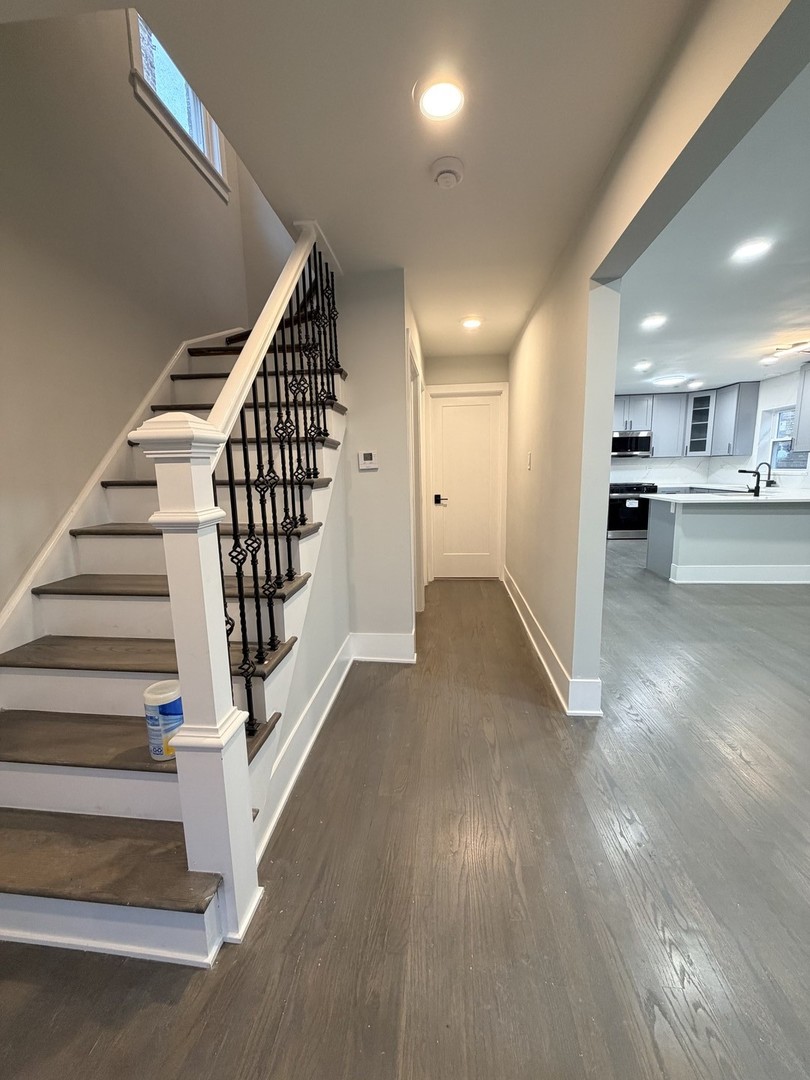 3024 West Fargo Avenue Chicago, IL 60645 - Photo 13 of 38 a view of entryway and hall with wooden floor