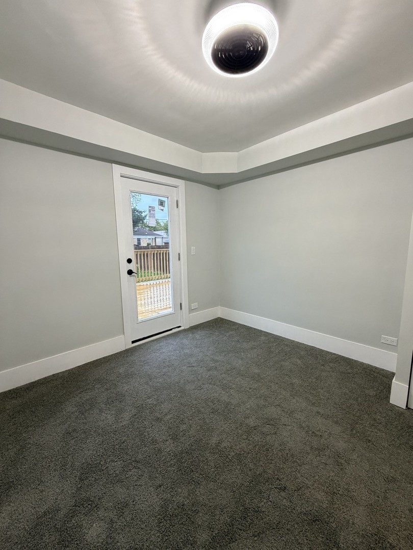 3024 West Fargo Avenue Chicago, IL 60645 - Photo 15 of 38 an empty room with a empty space and windows