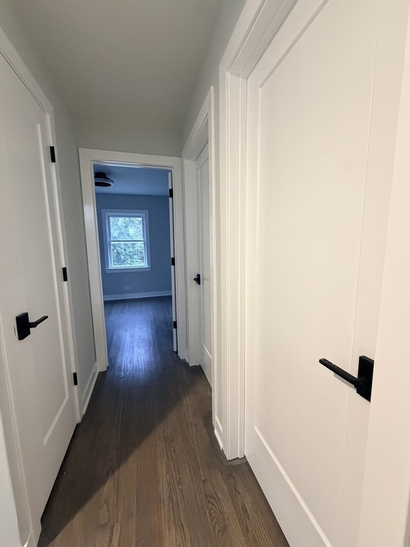 3024 West Fargo Avenue Chicago, IL 60645 - Photo 22 of 38 a view of a hallway with wooden floor