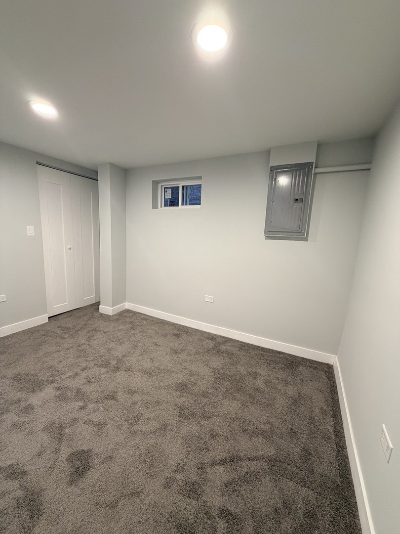 3024 West Fargo Avenue Chicago, IL 60645 - Photo 33 of 38 an empty room with a natural light