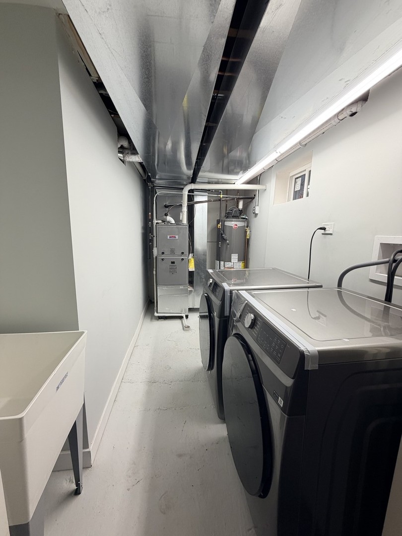 3024 West Fargo Avenue Chicago, IL 60645 - Photo 37 of 38 a utility room with dryer and washer