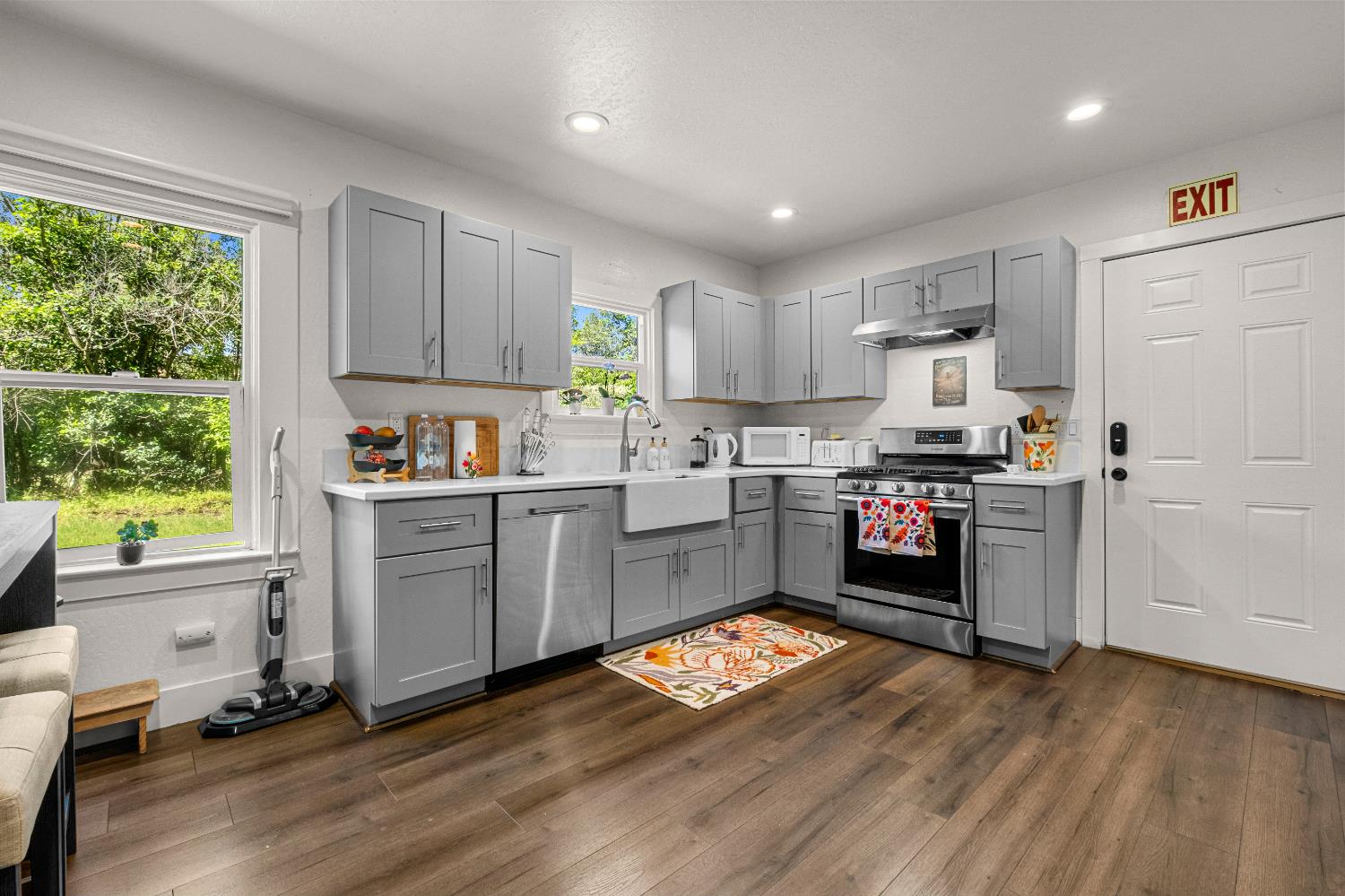 320 Taylor Road Newcastle, CA 95658 - Photo 20 of 75 a kitchen with granite countertop a refrigerator a stove a sink dishwasher and white cabinets with wooden floor