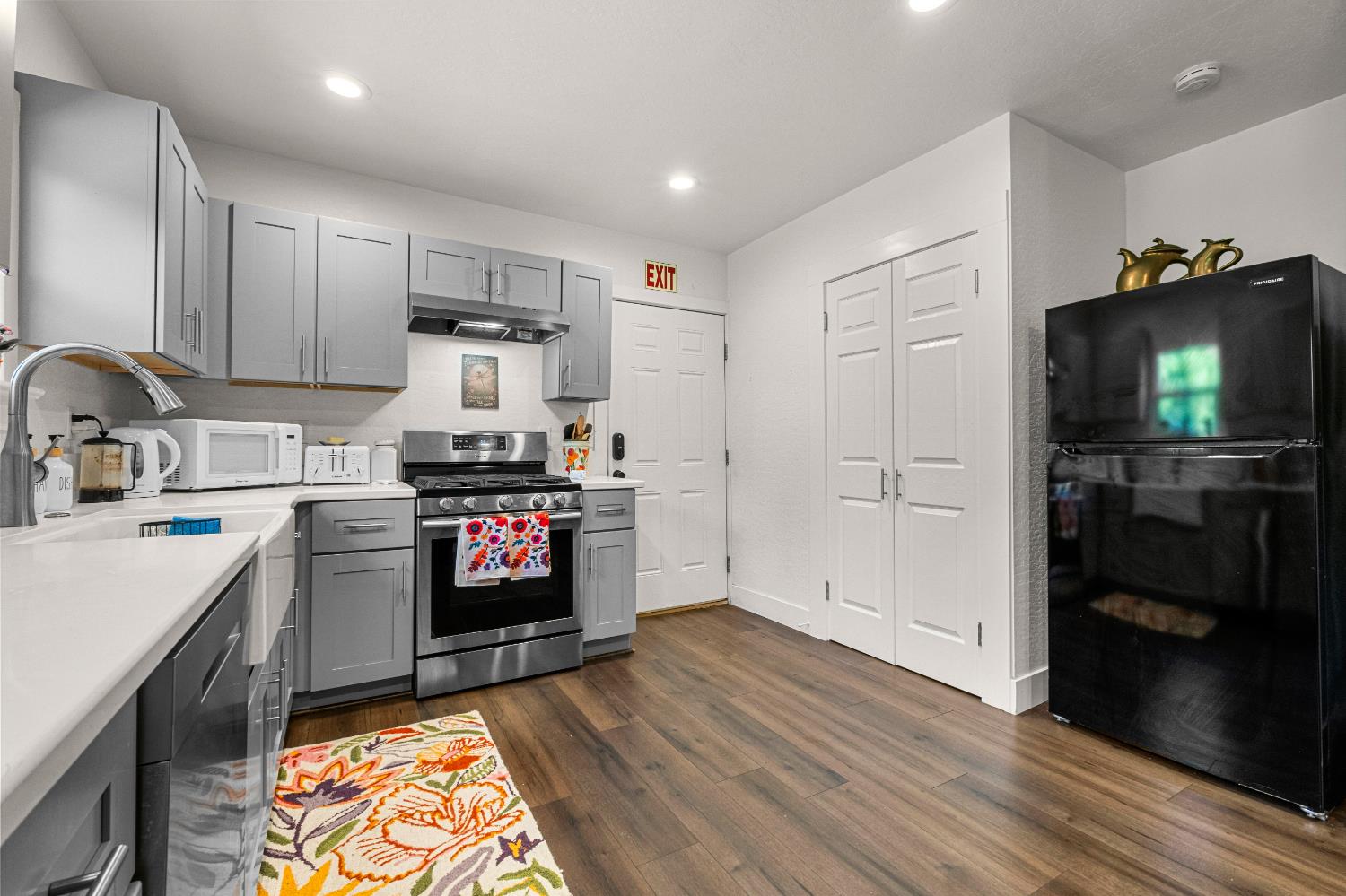320 Taylor Road Newcastle, CA 95658 - Photo 22 of 75 a kitchen with a refrigerator and a stove top oven
