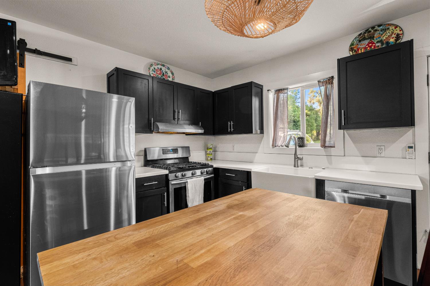 320 Taylor Road Newcastle, CA 95658 - Photo 42 of 75 a kitchen with stainless steel appliances a stove refrigerator sink and microwave