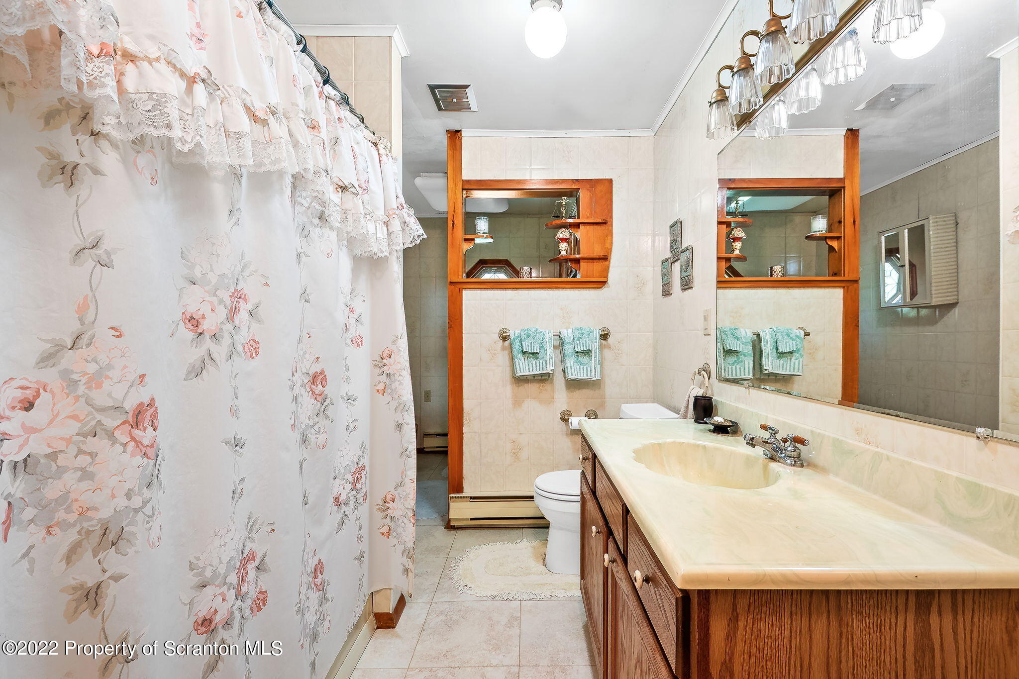 423 Fairview Road Dalton, PA 18414 - Photo 12 of 21 a bathroom with a sink and a mirror