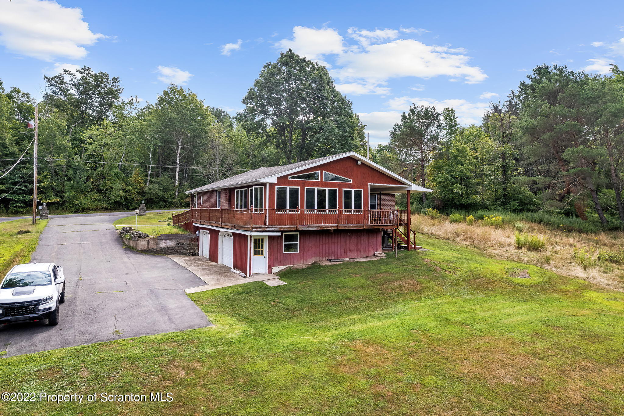 423 Fairview Road Dalton, PA 18414 - Photo 5 of 21 a view of a house with a big yard