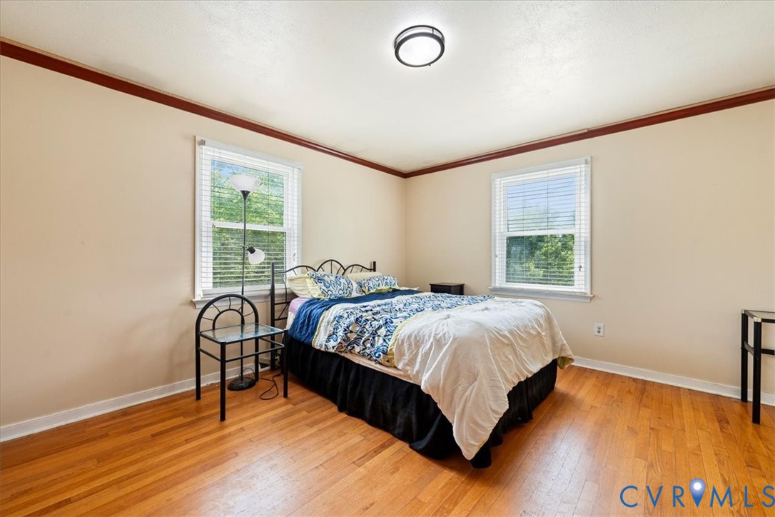 296 Rices Depot Road Rice, VA 23966 - Photo 21 of 32 Bedroom featuring wood-finish flooring, two window