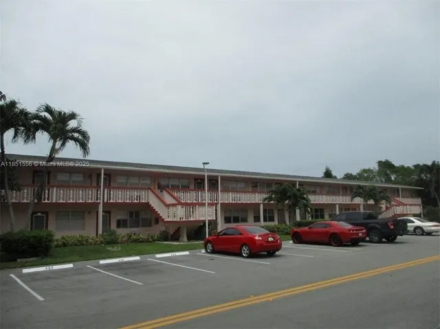 a view of a cars parked in front of a building