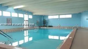 a view of swimming pool with a yard